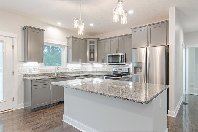 Remodeled kitchen with gray cabinets